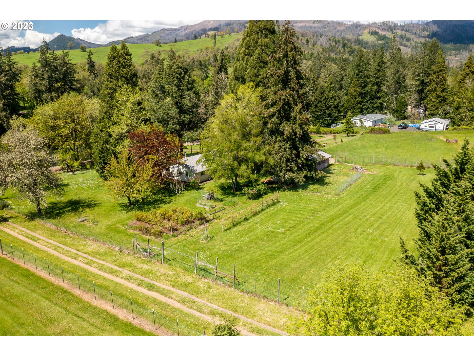 695 Lone Rock Road Glide, OR 97443 - Photo 30 of 48 a view of a yard with an outdoor space