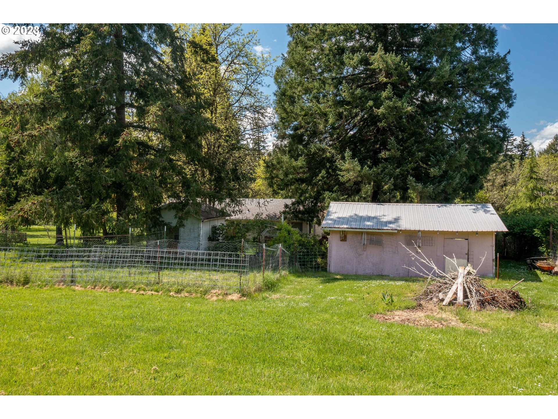 695 Lone Rock Road Glide, OR 97443 - Photo 33 of 48 a swimming pool with outdoor seating and yard