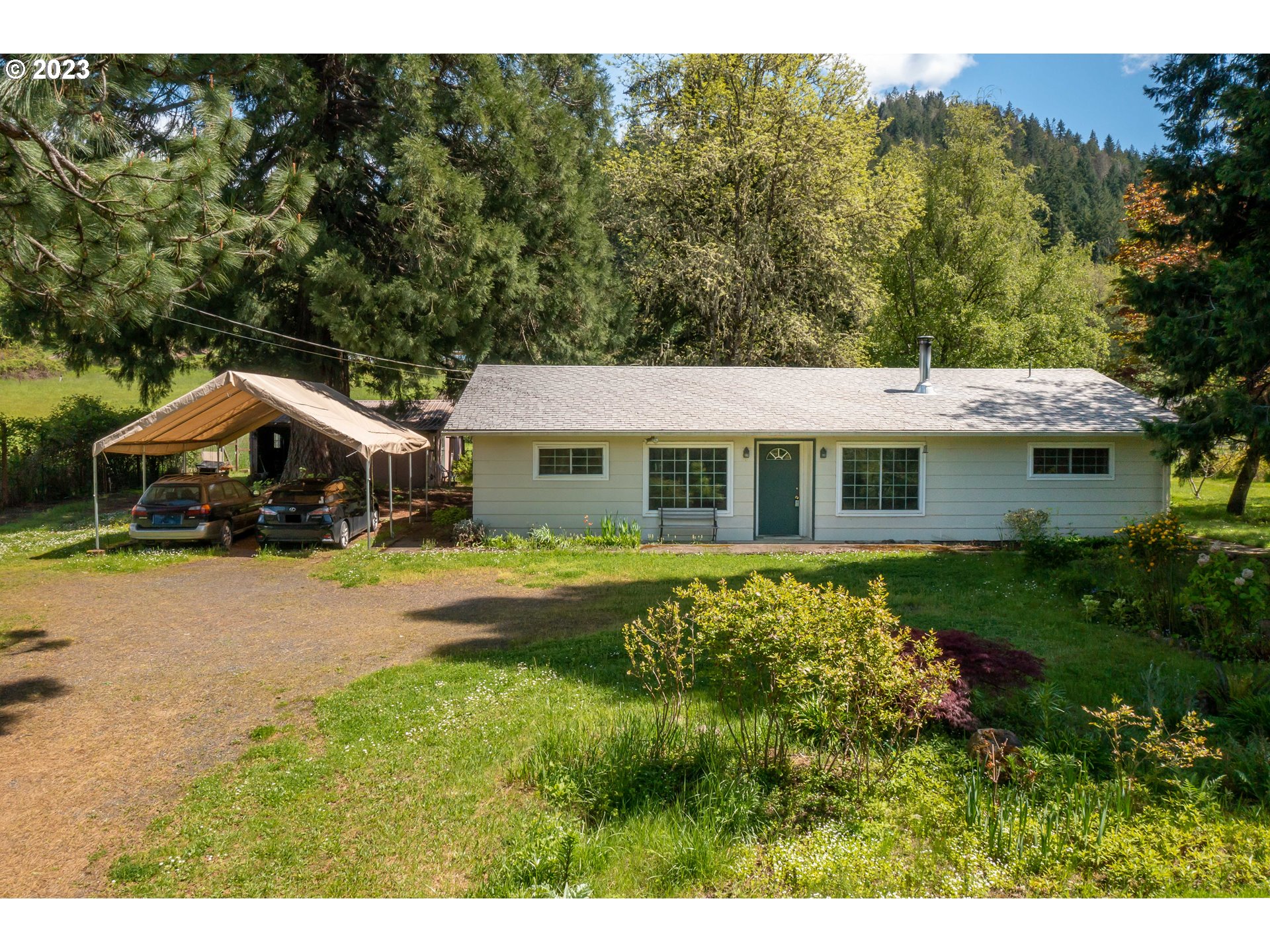 695 Lone Rock Road Glide, OR 97443 - Photo 39 of 48 a aerial view of a house with swimming pool and porch