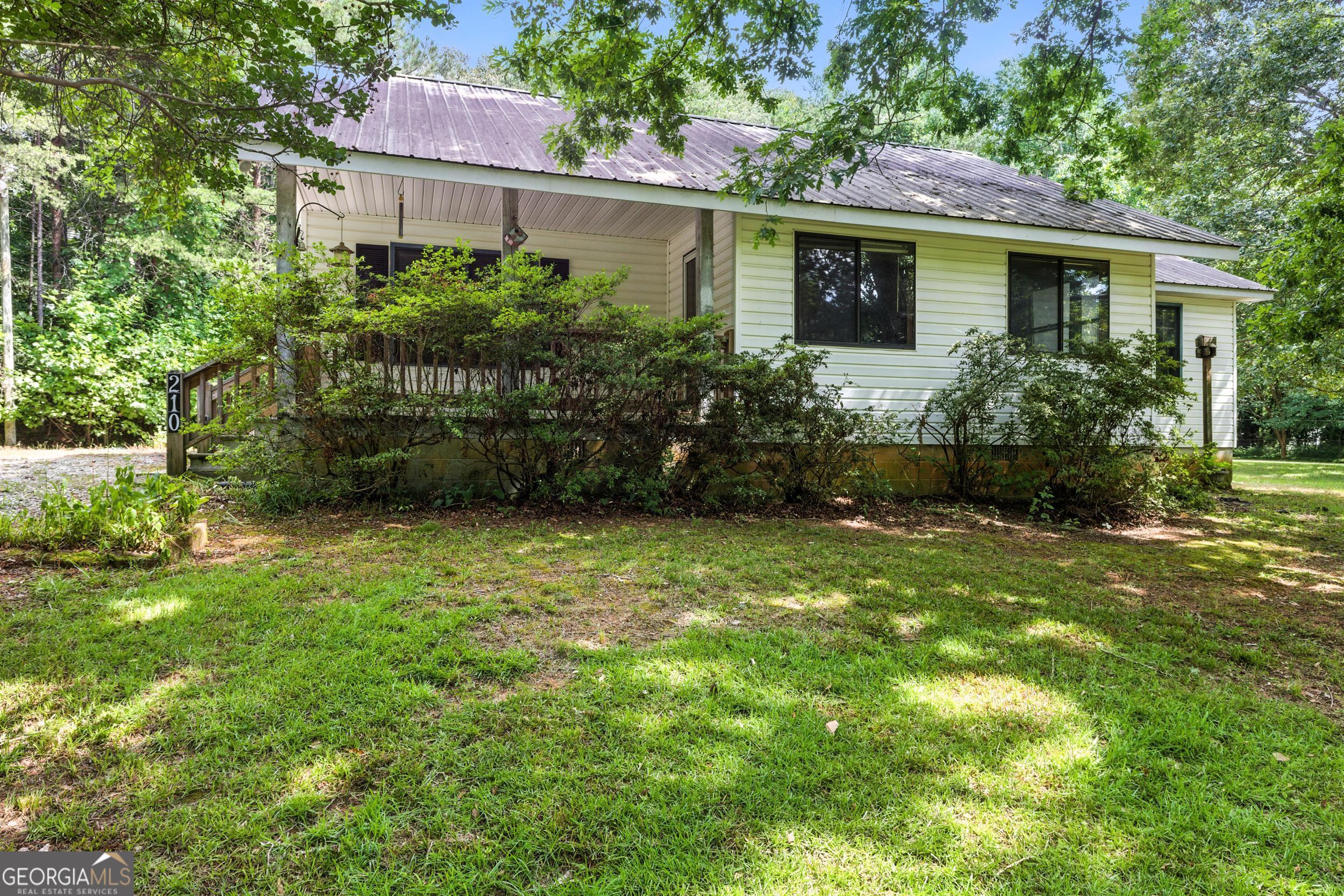 a view of a house with garden and plants