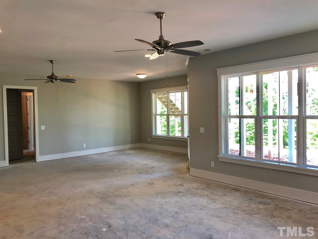 112 Roseroot Court Holly Springs, NC 27540 - Photo 10 of 30 a view of an empty room with a window