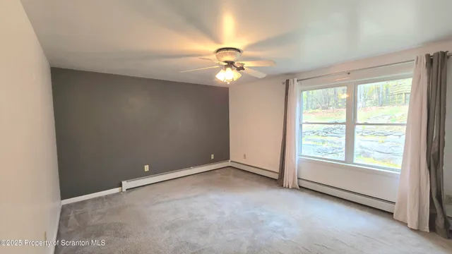 a view of a livingroom with a staircase