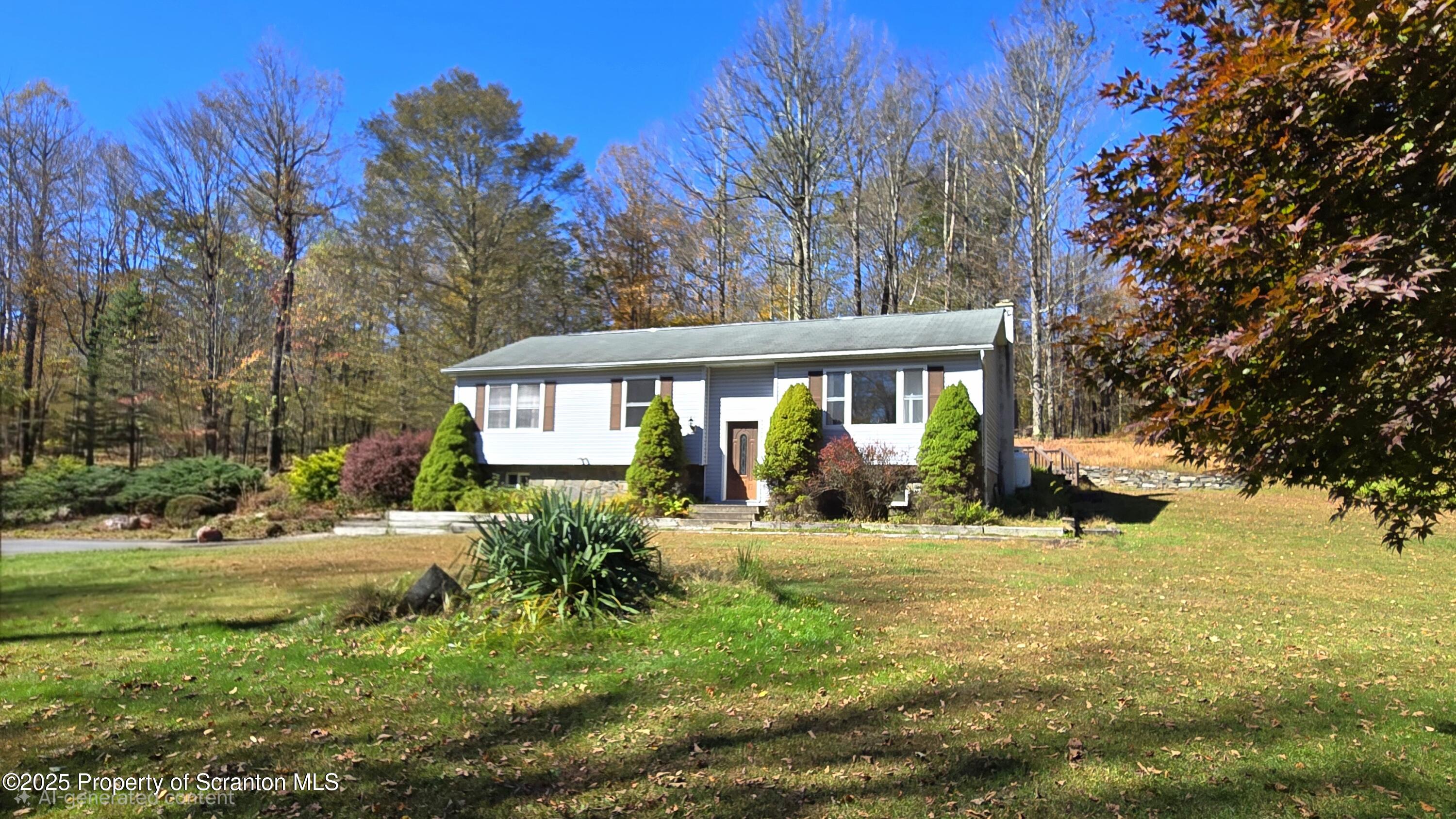 2311 Motichka Road Moscow, PA 18444 - Photo 2 of 89 a front view of a house with a yard