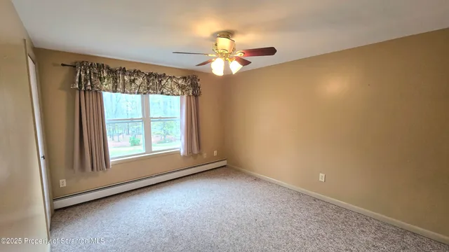 a bathroom with a sink toilet and mirror