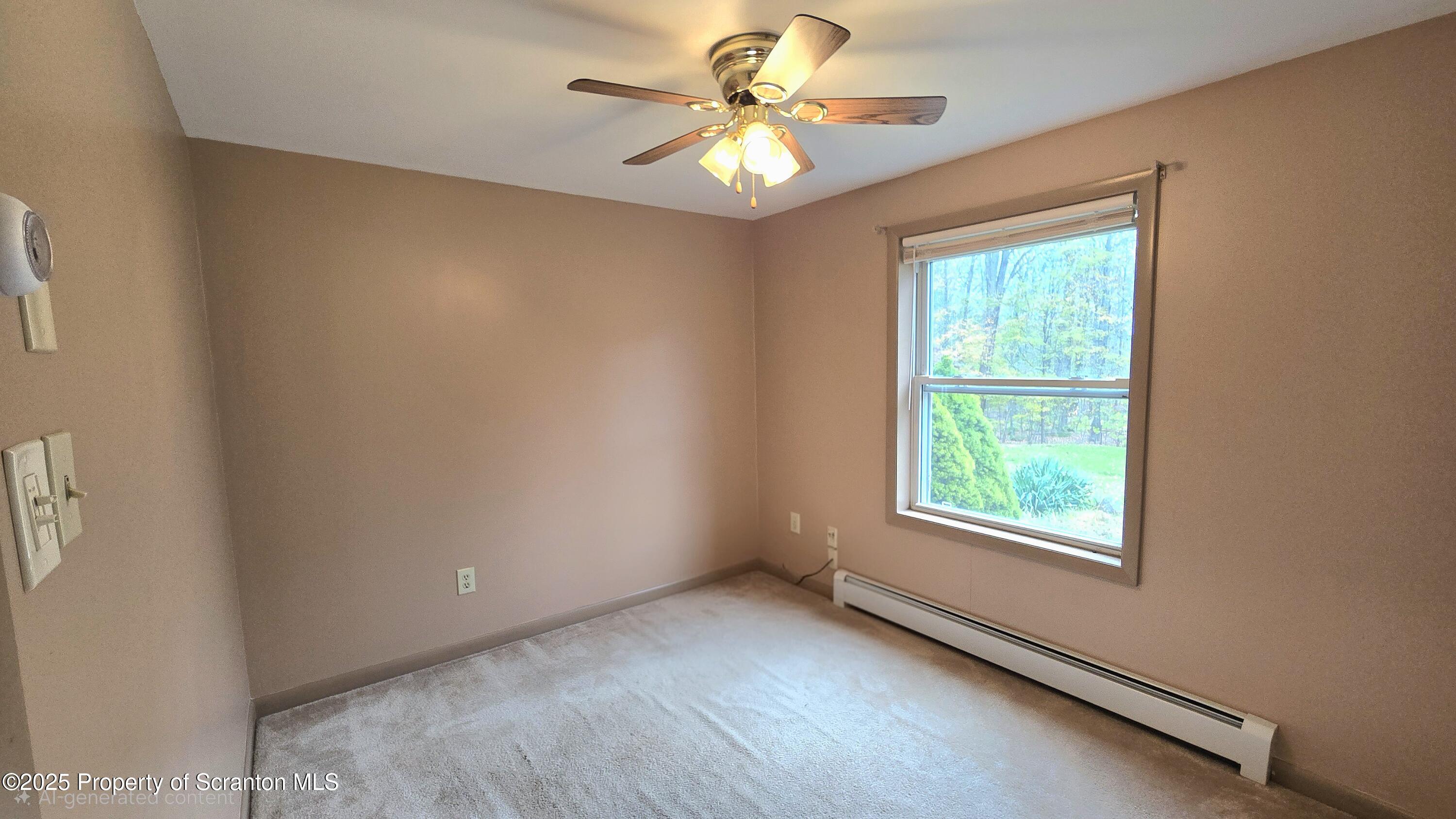 2311 Motichka Road Moscow, PA 18444 - Photo 23 of 89 an empty room with windows and fan