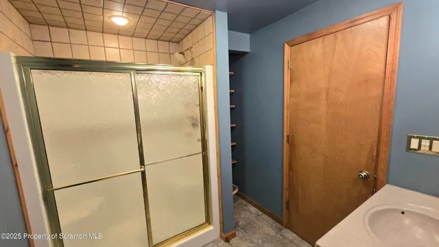 a view of a hallway with stairs