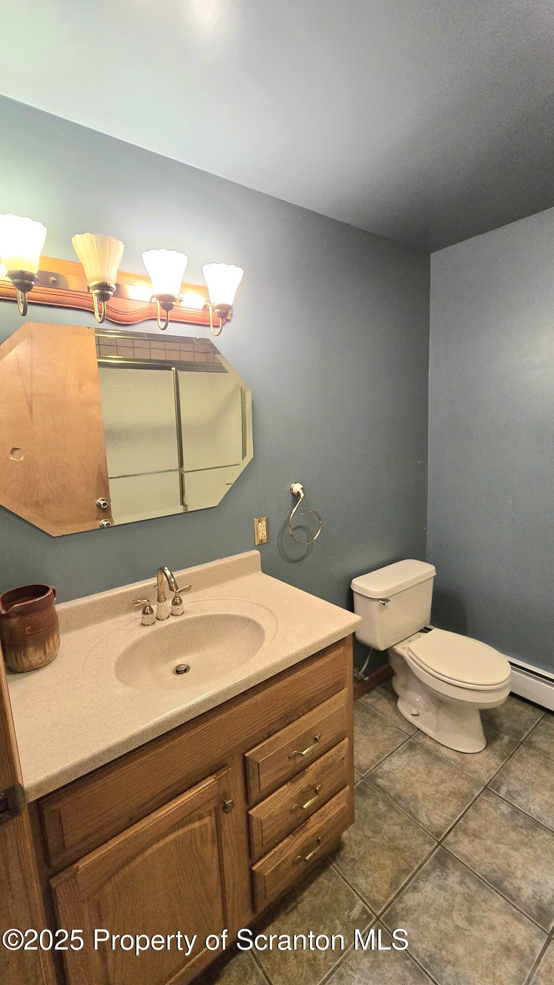 2311 Motichka Road Moscow, PA 18444 - Photo 31 of 89 a bathroom with a sink toilet and mirror