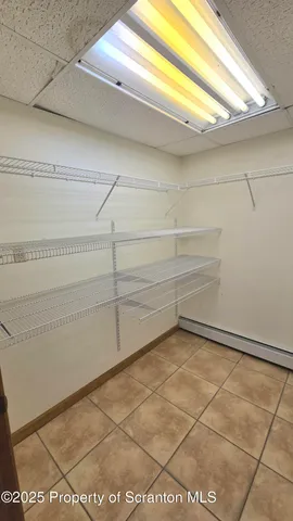 a bathroom with a toilet a sink and a mirror