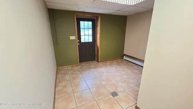 a view of an empty room with a fireplace