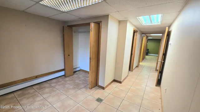 a view of a bathroom with a black and white checkered floor