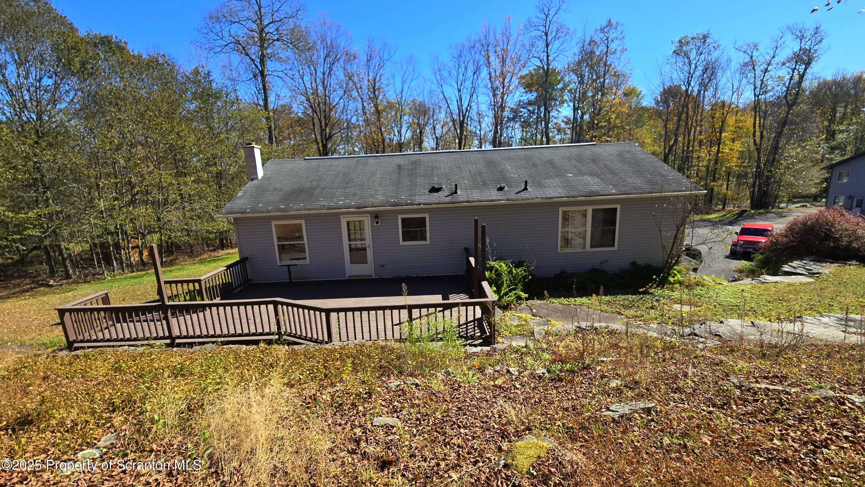 2311 Motichka Road Moscow, PA 18444 - Photo 78 of 89 a view of a house with backyard and sitting area