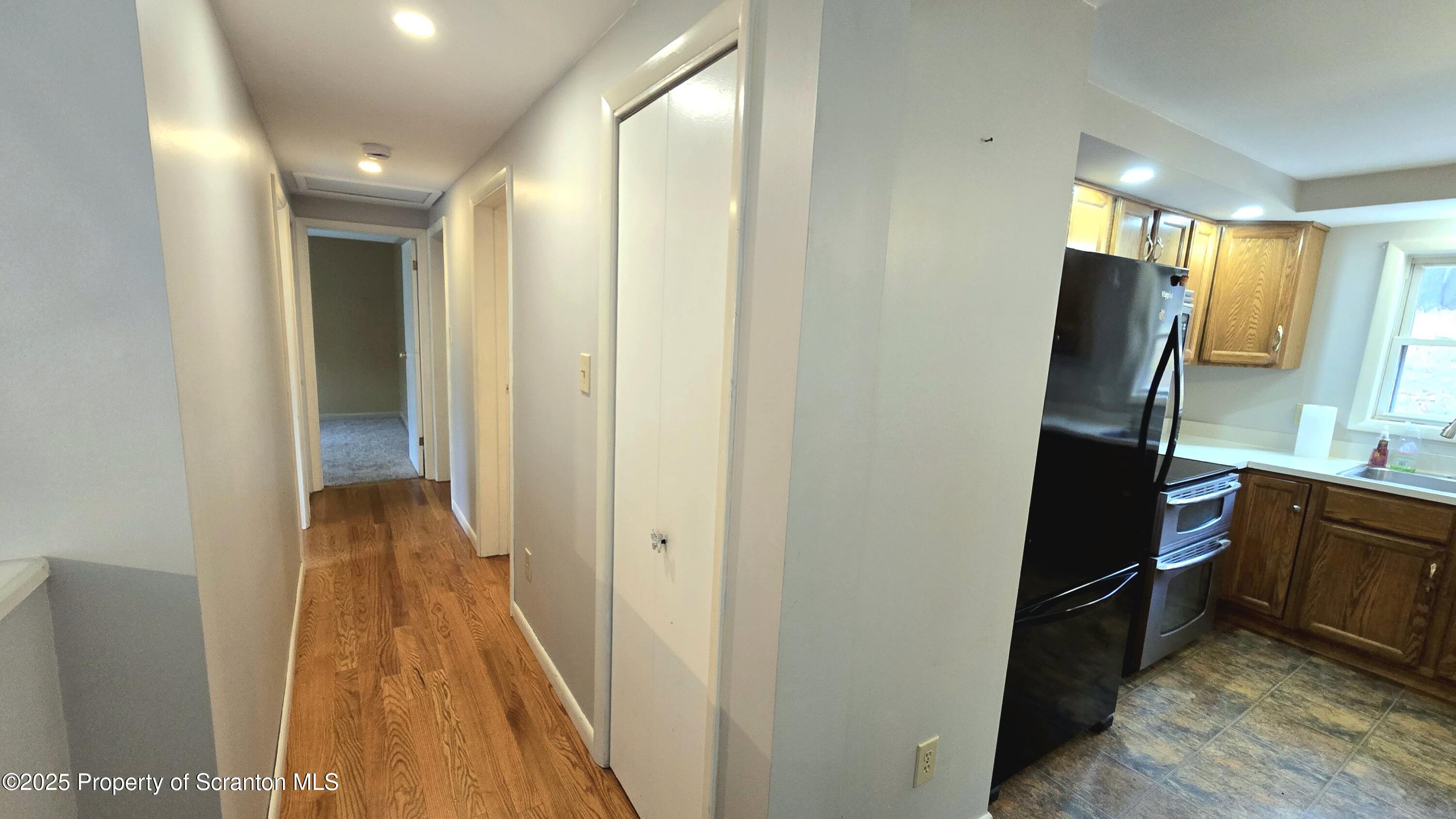 2311 Motichka Road Moscow, PA 18444 - Photo 10 of 89 a view of a hallway with wooden floor and furniture