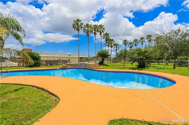 a view of an swimming pool with an outdoor seating