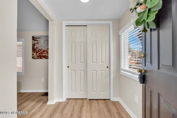 a view of entryway with wooden floor