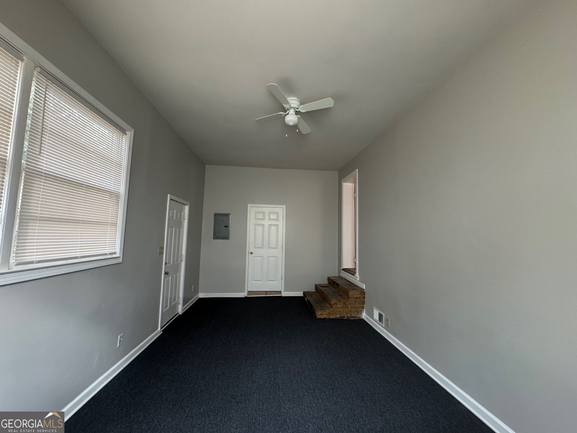 3515 Greenbriar Road Macon, GA 31204 - Photo 14 of 22 an empty room with a window and a ceiling fan