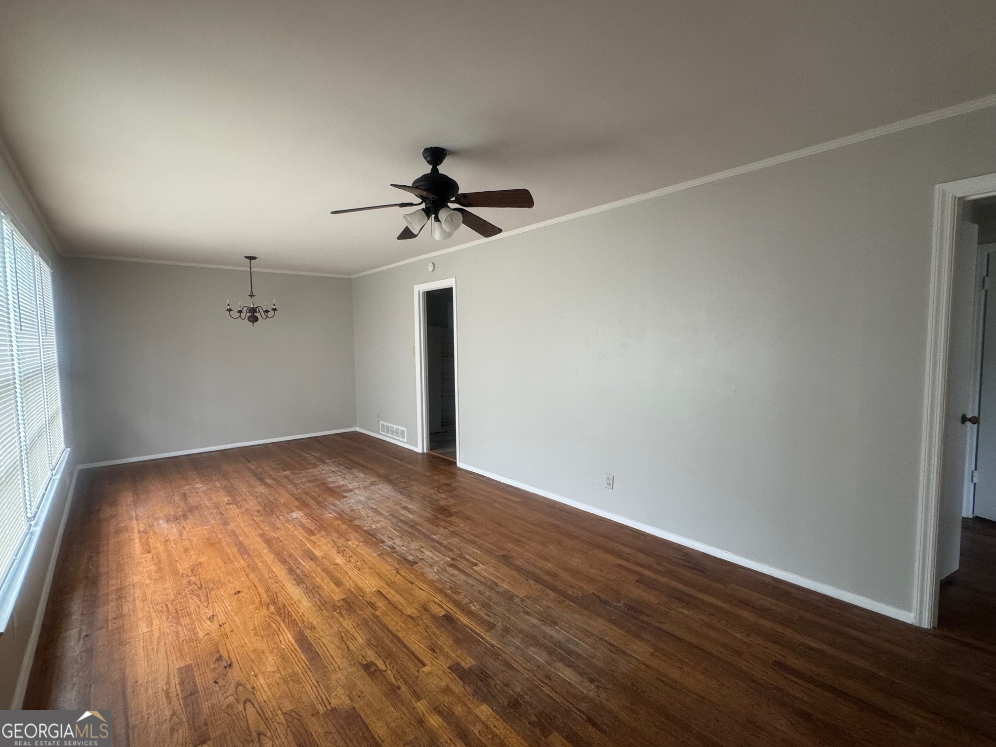 3515 Greenbriar Road Macon, GA 31204 - Photo 2 of 22 a view of empty room with wooden floor and fan