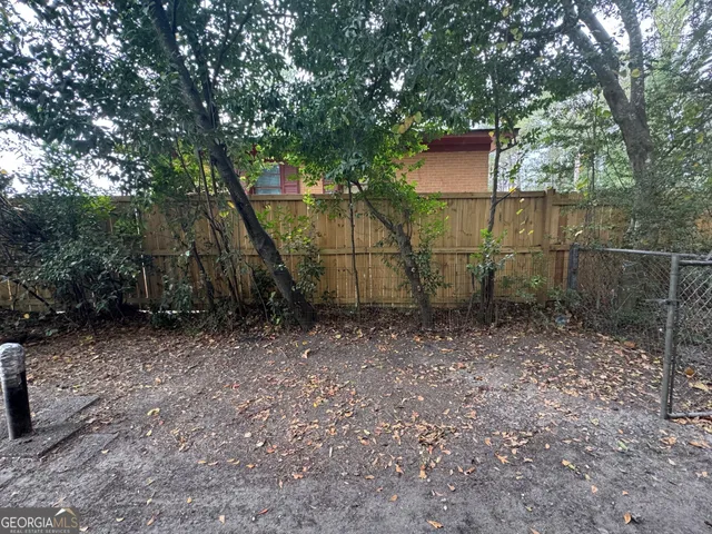 a view of empty field with trees