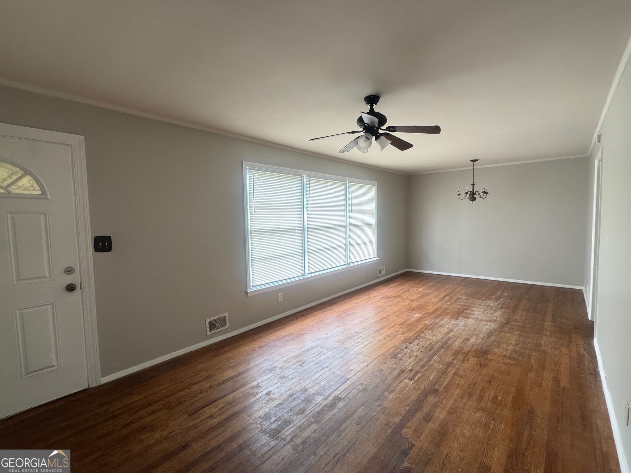 3515 Greenbriar Road Macon, GA 31204 - Photo 3 of 22 wooden floor in an empty room with a window