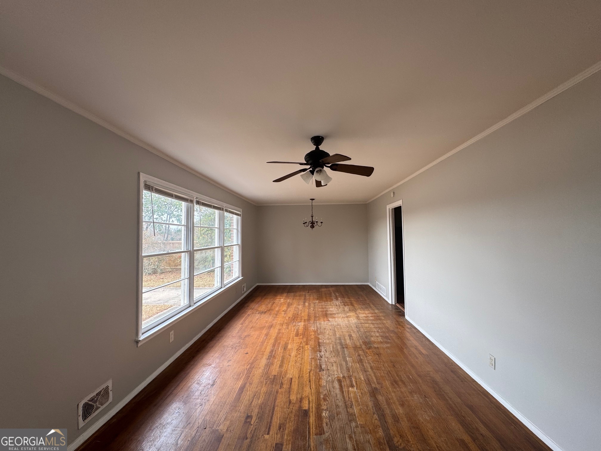 3515 Greenbriar Road Macon, GA 31204 - Photo 5 of 22 wooden floor in an empty room with a window