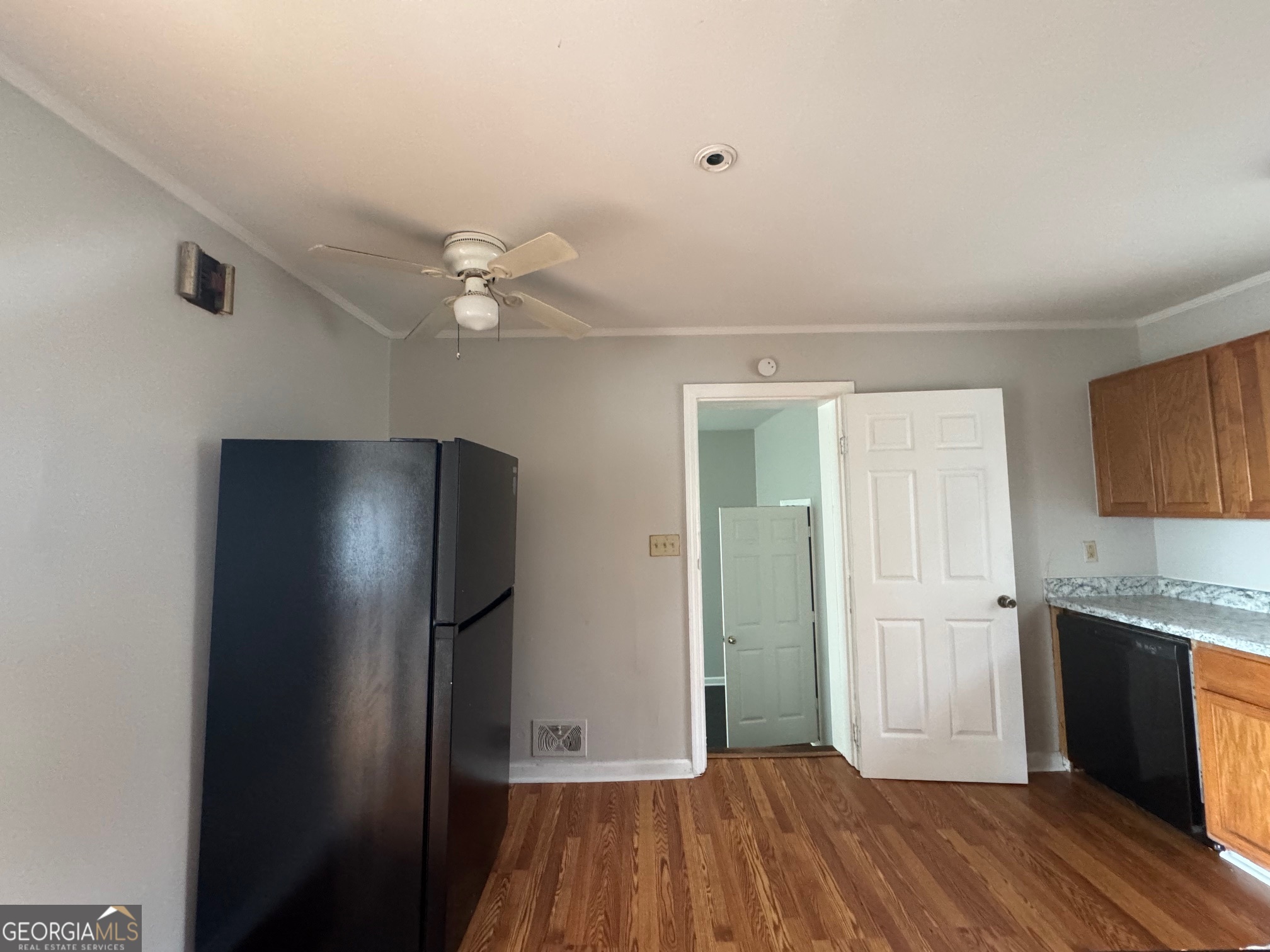 3515 Greenbriar Road Macon, GA 31204 - Photo 7 of 22 a view of a kitchen with a sink and a refrigerator