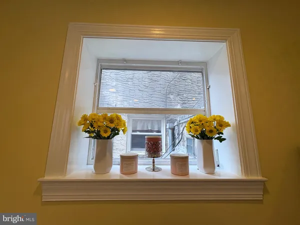 a vase of flowers sitting on a table