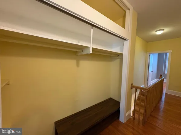 a view of room with wooden floor and chair
