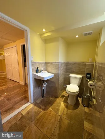 a bathroom with a toilet and a sink