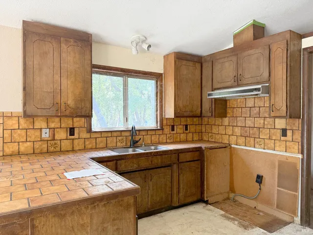 a bathroom with a sink toilet and tub