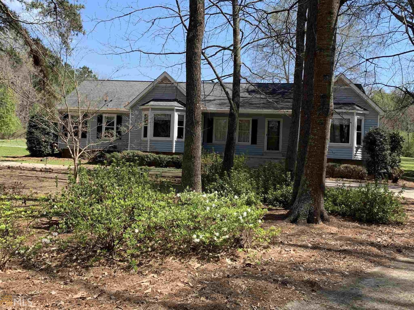 2933 Highway 155 South Locust Grove, GA 30248 - Photo 1 of 1 a front view of a house with garden