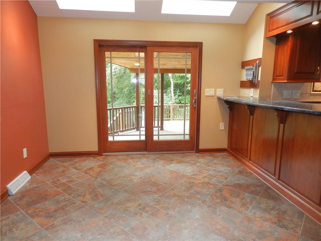 2533 Riva Ridge Court Franklin Park, PA 15090 - Photo 14 of 25 This wonderful room sits off of the kitchen and can be used for a breakfast room, den or office. It fills with natural light from the skylights and sliding deck doors.