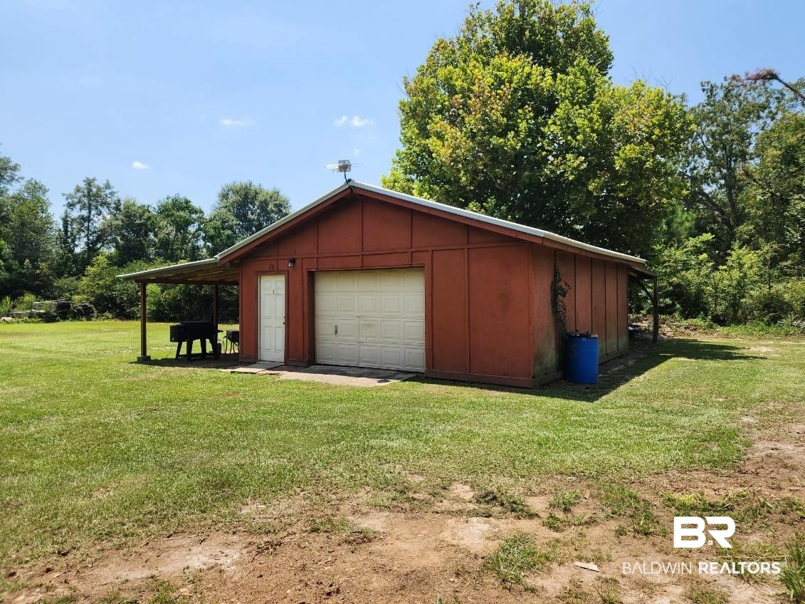 640 Horseshoe Road Brewton, AL 36426 - Photo 22 of 22 Garage with a yard