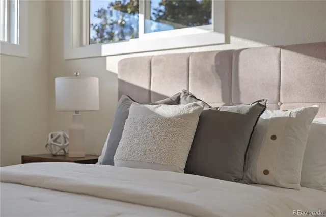 a bedroom with a bed and window