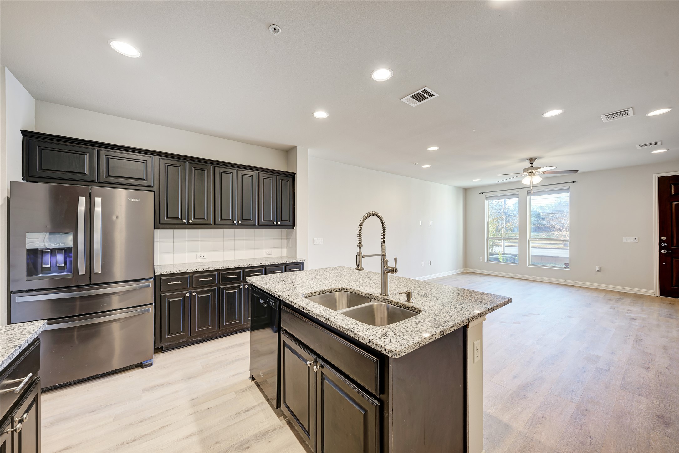6814 East Riverside Drive, Unit 32 Austin, TX 78741 - Photo 7 of 26 a kitchen that has a sink and stainless steel appliances