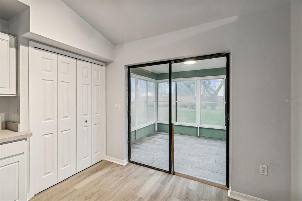 2255 Ancho Avenue Spring Hill, FL 34608 - Photo 15 of 24 a view of an empty room and window wooden floor