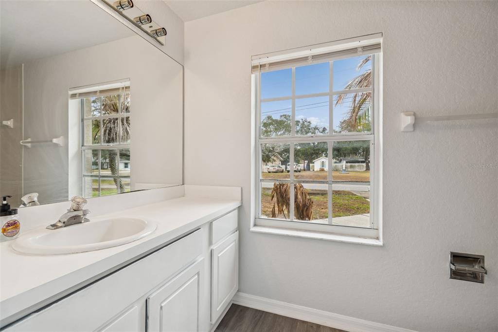 2255 Ancho Avenue Spring Hill, FL 34608 - Photo 17 of 24 a bathroom with a sink and a window
