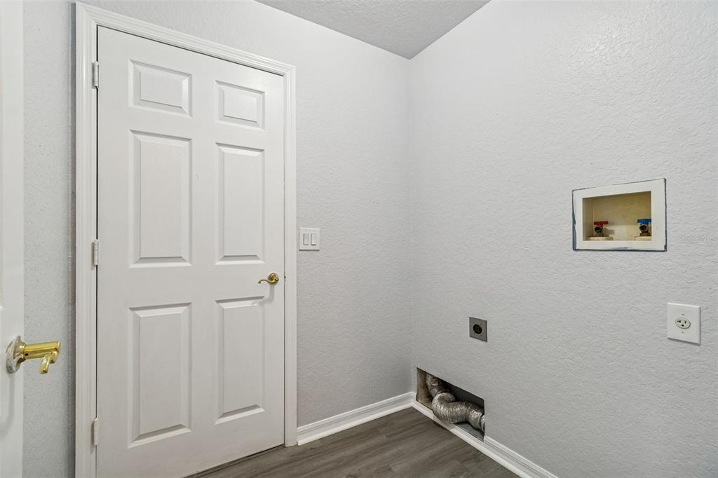 2255 Ancho Avenue Spring Hill, FL 34608 - Photo 19 of 24 an empty room with wooden floor