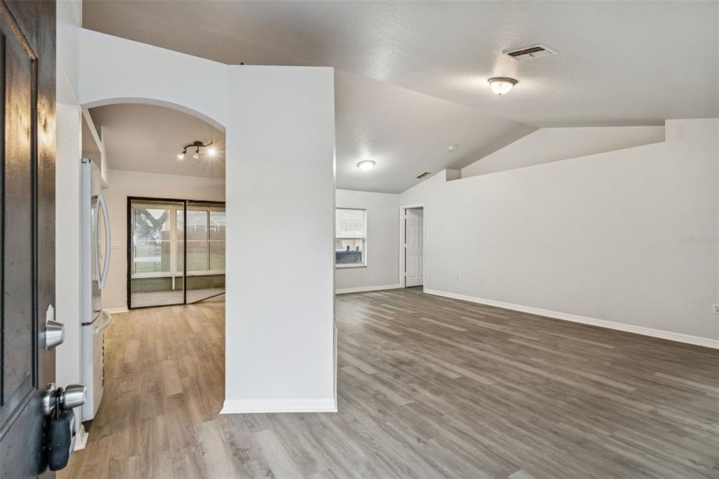 2255 Ancho Avenue Spring Hill, FL 34608 - Photo 2 of 24 wooden floor in an empty room with wooden floor