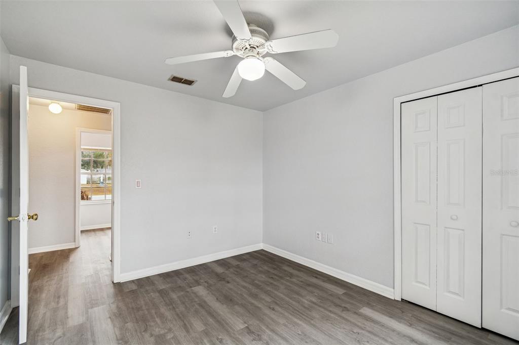 2255 Ancho Avenue Spring Hill, FL 34608 - Photo 21 of 24 wooden floor in an empty room with a window