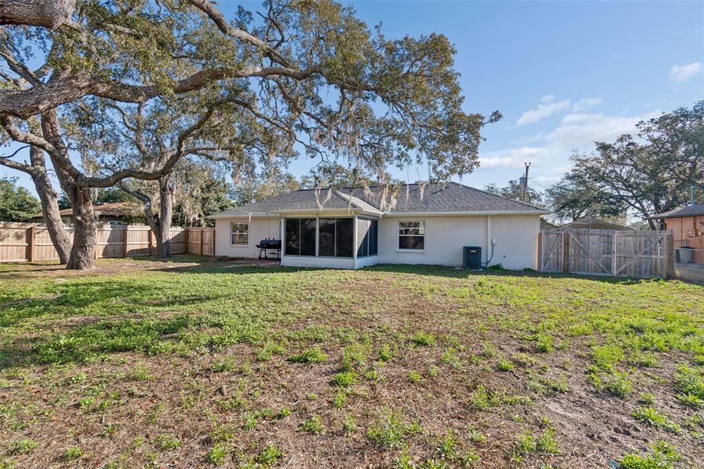 2255 Ancho Avenue Spring Hill, FL 34608 - Photo 24 of 24 a front view of a house with a yard