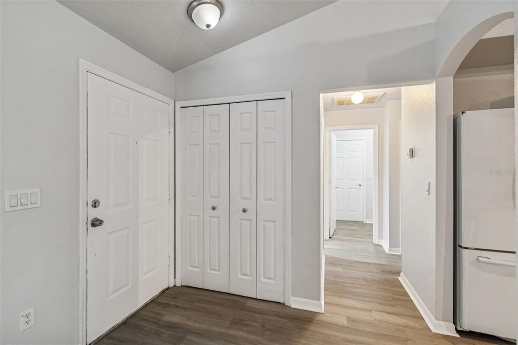 2255 Ancho Avenue Spring Hill, FL 34608 - Photo 3 of 24 a view of a hallway with wooden floor