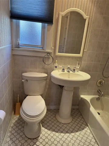a kitchen with a refrigerator sink stove and cabinets