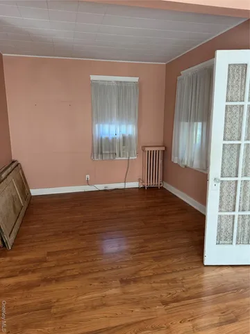 a kitchen with a cabinets and chandelier