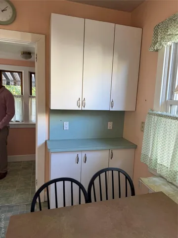 a view of a refrigerator in a kitchen