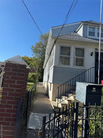 a view of a patio with table and chairs with wooden floor and fence