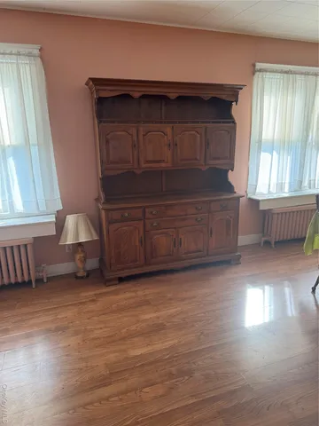 a living room with a furniture and a fireplace