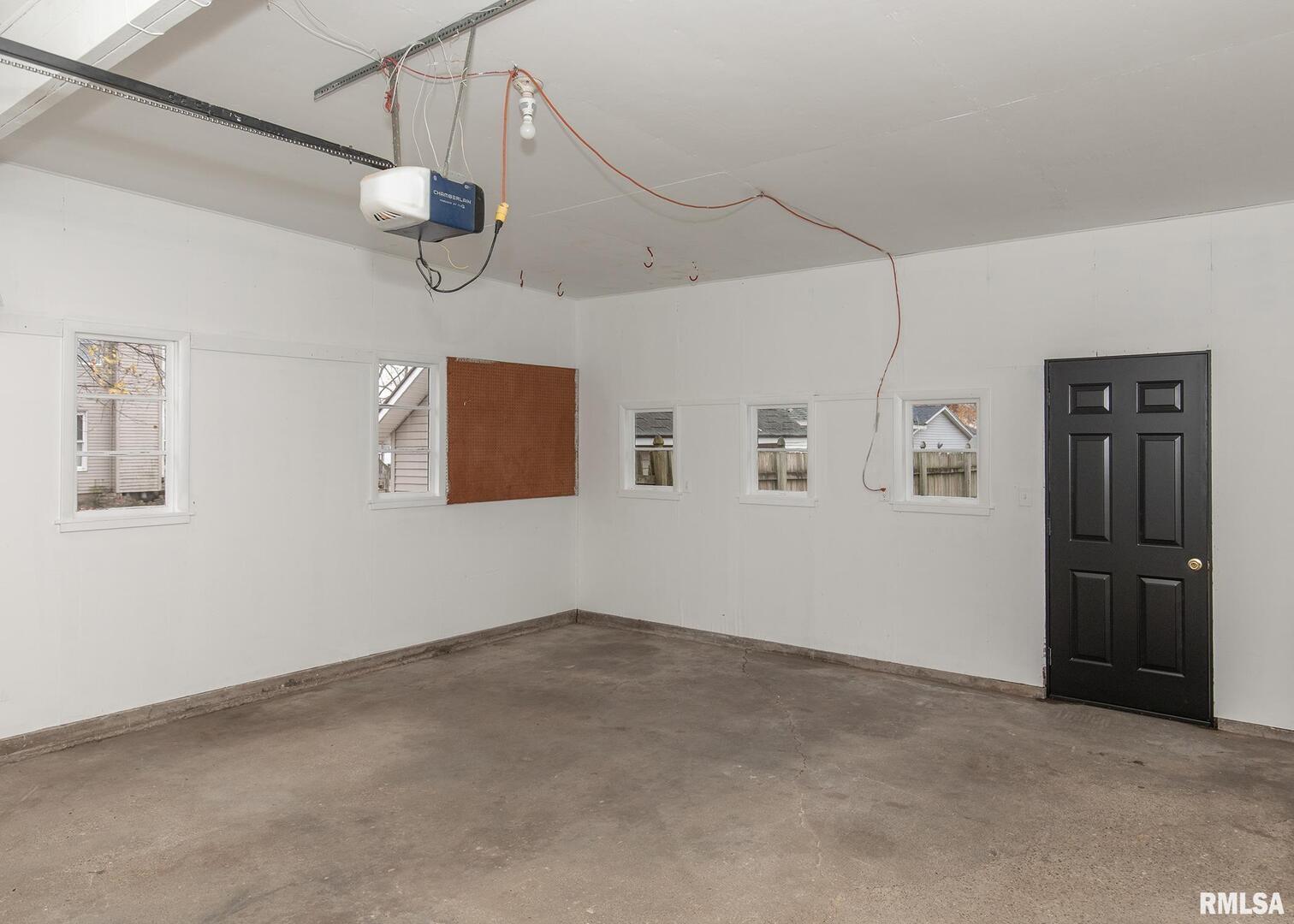 213 North Williams Street Geneseo, IL 61254 - Photo 41 of 42 a view of an empty room with a fan