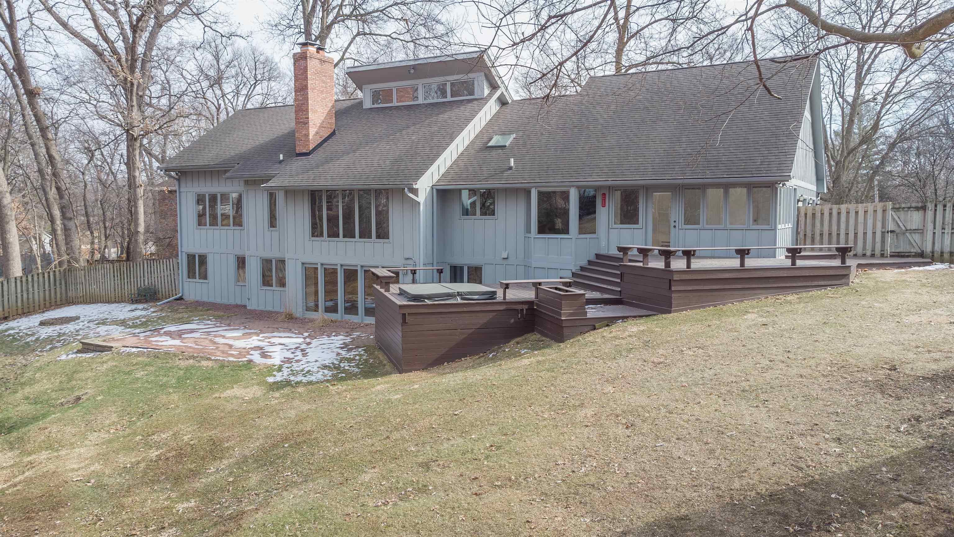 a view of a house with backyard and snow