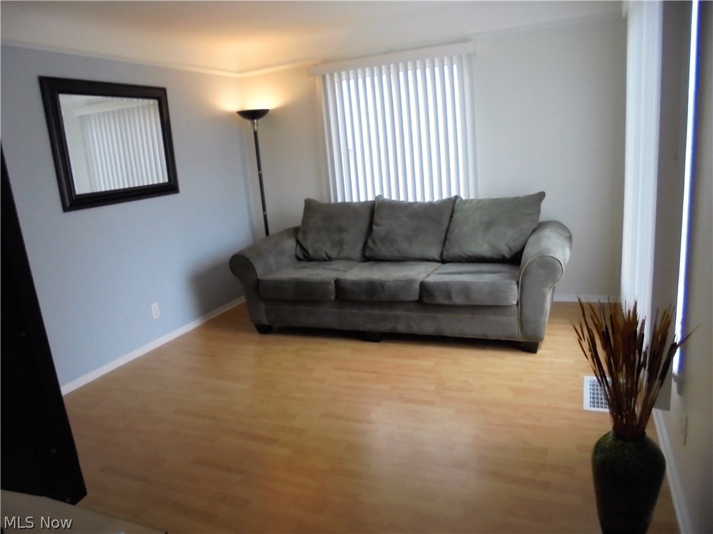 8219 Snow Road Parma, OH 44129 - Photo 3 of 22 Abundance of natural light through the large windows in the inviting living room.