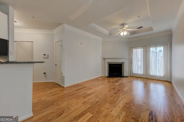 wooden floor in an empty room with a fireplace