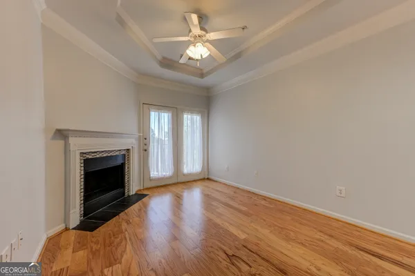 a view of livingroom with window fireplace and ceiling fan